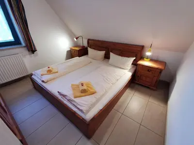 Ein Bett oder Betten in einem Zimmer der Unterkunft OstseeBrise