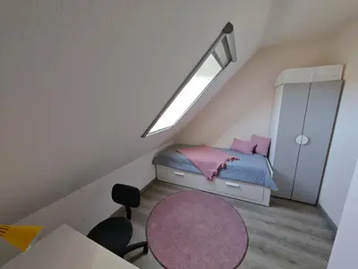 Ein Bett oder Betten in einem Zimmer der Unterkunft CapitänsLiebe
