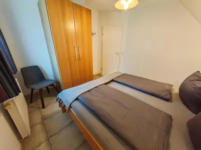 Ein Bett oder Betten in einem Zimmer der Unterkunft DeichLiebe