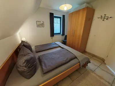Ein Bett oder Betten in einem Zimmer der Unterkunft DeichLiebe