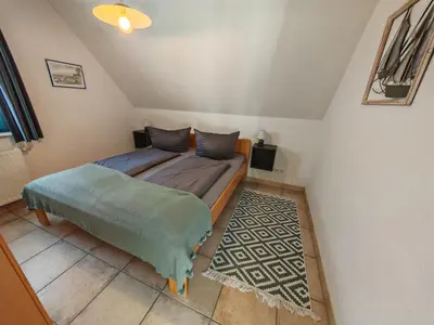 Ein Bett oder Betten in einem Zimmer der Unterkunft BoddenLiebe