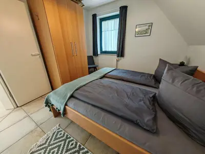 Ein Bett oder Betten in einem Zimmer der Unterkunft BoddenLiebe