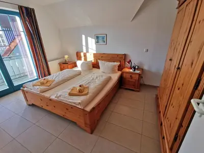 Ein Bett oder Betten in einem Zimmer der Unterkunft SteuerbordBrise