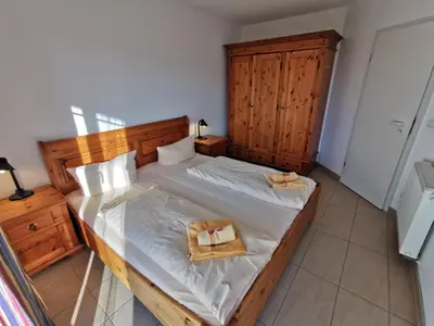 Ein Bett oder Betten in einem Zimmer der Unterkunft MeeresBrise