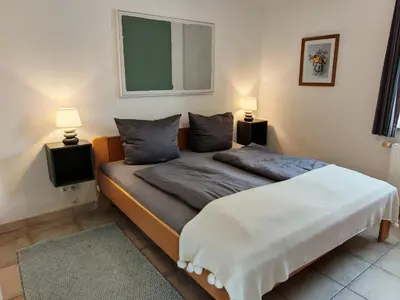 Ein Bett oder Betten in einem Zimmer der Unterkunft KüstenLiebe