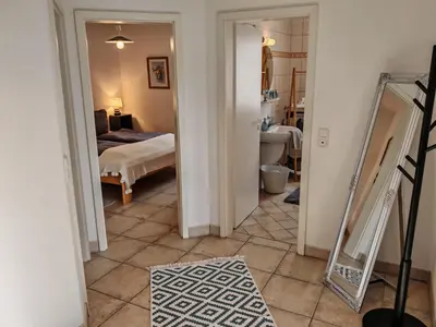 Ein Bett oder Betten in einem Zimmer der Unterkunft KüstenLiebe