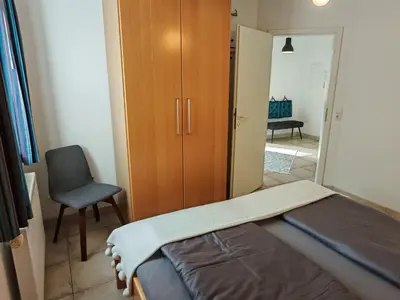 Ein Bett oder Betten in einem Zimmer der Unterkunft KüstenLiebe