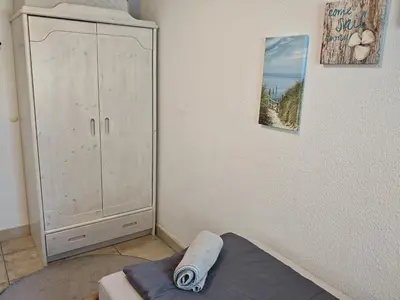 Ein Bett oder Betten in einem Zimmer der Unterkunft KüstenLiebe