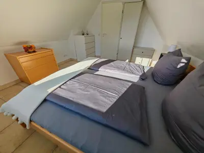 Ein Bett oder Betten in einem Zimmer der Unterkunft MeeresLiebe