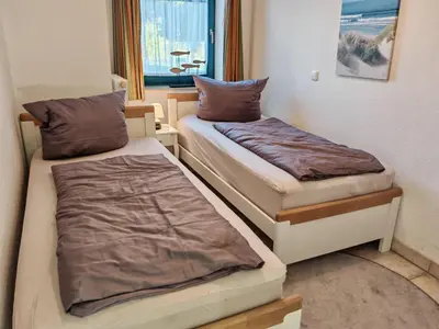 Ein Bett oder Betten in einem Zimmer der Unterkunft StrandLiebe