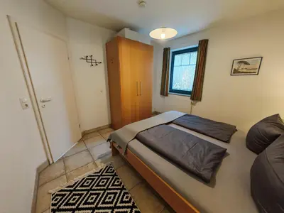 Ein Bett oder Betten in einem Zimmer der Unterkunft StrandLiebe