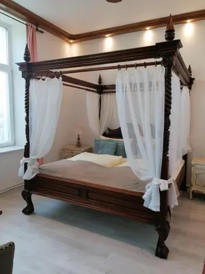 Ein Bett oder Betten in einem Zimmer der Unterkunft Ferienwohnung 1 Landhaus Thätner
