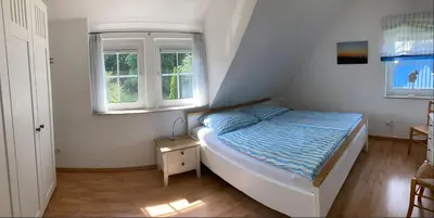 Ein Bett oder Betten in einem Zimmer der Unterkunft Meerglück - Ferienhaus mit gehobener Ausstattung