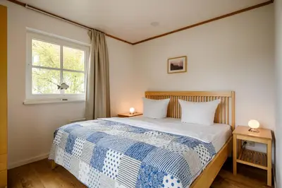 Ein Bett oder Betten in einem Zimmer der Unterkunft Sandsturm
