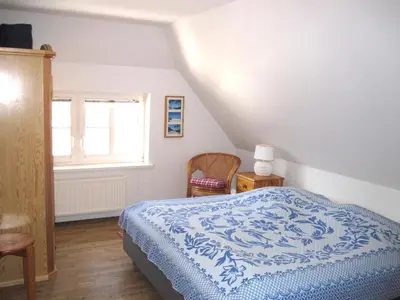 Ein Bett oder Betten in einem Zimmer der Unterkunft Ellas Kate Schwalbennest