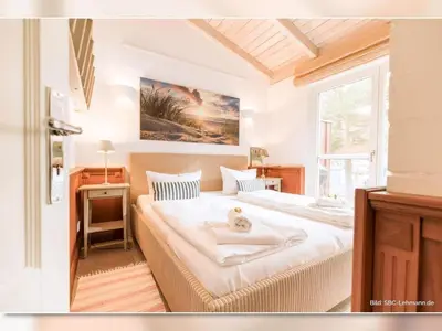 Ein Bett oder Betten in einem Zimmer der Unterkunft Strandhaus 