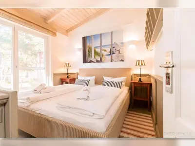 Ein Bett oder Betten in einem Zimmer der Unterkunft Strandhaus 