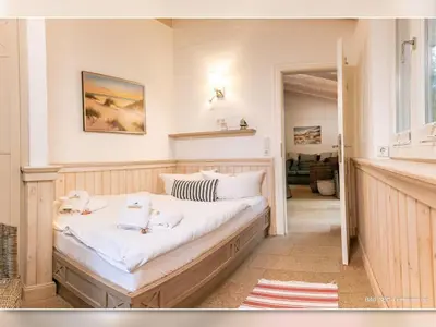 Ein Bett oder Betten in einem Zimmer der Unterkunft Strandhaus 