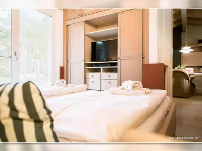 Ein Bett oder Betten in einem Zimmer der Unterkunft Strandhaus 