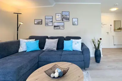 Ein Sitzbereich in der Unterkunft Sandbank No 4