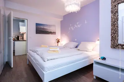 Ein Bett oder Betten in einem Zimmer der Unterkunft Kormoran Kranichflug