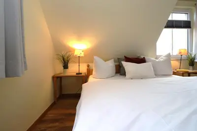 Ein Bett oder Betten in einem Zimmer der Unterkunft Lange Straße Likedeeler