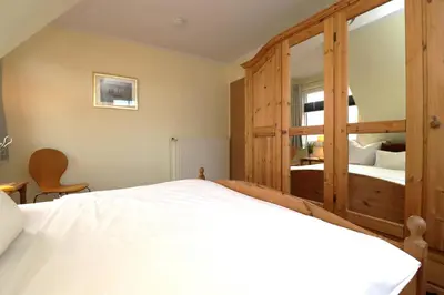 Ein Bett oder Betten in einem Zimmer der Unterkunft Lange Straße Likedeeler