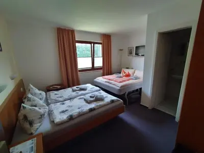 Ein Bett oder Betten in einem Zimmer der Unterkunft Pension Stocker