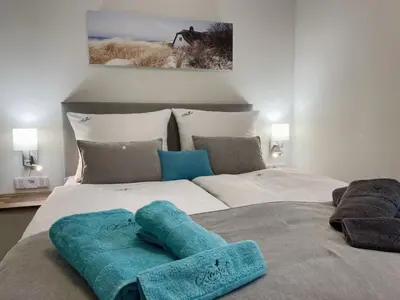Ein Bett oder Betten in einem Zimmer der Unterkunft Ferienwohnung Kleine Auszeit - b50593