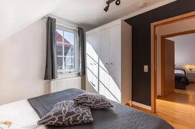 Ein Bett oder Betten in einem Zimmer der Unterkunft Kleines Boddenidyll