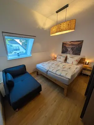 Ein Bett oder Betten in einem Zimmer der Unterkunft Haus Erika