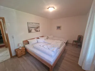 Ein Bett oder Betten in einem Zimmer der Unterkunft Haus Erika