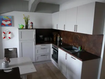 Küche/Küchenzeile in der Unterkunft Speicher-Hafenblick 32