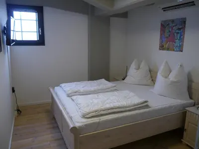 Ein Bett oder Betten in einem Zimmer der Unterkunft Speicher-Hafenblick 32