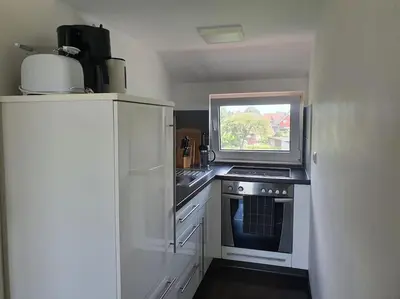 Küche/Küchenzeile in der Unterkunft Ferienwohnung MaLaMaBu am Kitespot Saal Ostsee