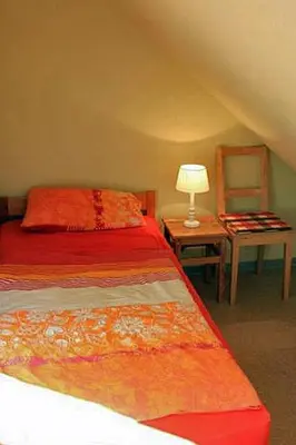 Ein Bett oder Betten in einem Zimmer der Unterkunft Ferienwohnung Apfelgarten am Pfarrgarten Starkow