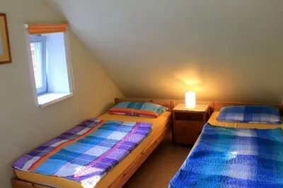 Ein Bett oder Betten in einem Zimmer der Unterkunft Ferienwohnung Birnengarten am Pfarrgarten Starkow