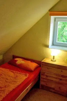 Ein Bett oder Betten in einem Zimmer der Unterkunft Ferienwohnung Birnengarten am Pfarrgarten Starkow