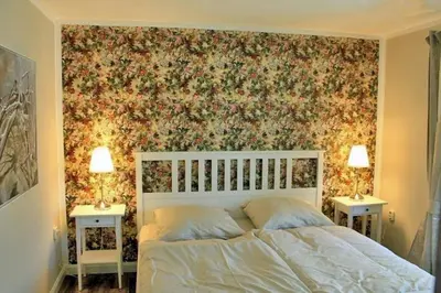 Ein Bett oder Betten in einem Zimmer der Unterkunft Ferienwohnung Rosengarten am Pfarrgarten Starkow