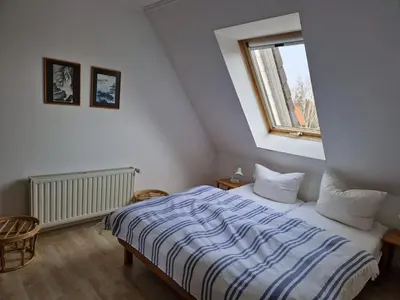 Ein Bett oder Betten in einem Zimmer der Unterkunft Whg 29 1 OG