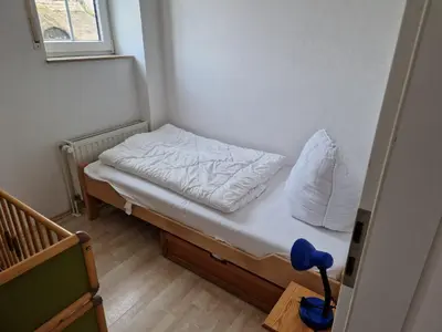 Ein Bett oder Betten in einem Zimmer der Unterkunft Whg 29 1 OG
