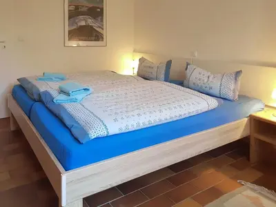 Ein Bett oder Betten in einem Zimmer der Unterkunft Achtern Darsswald E1
