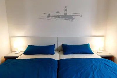 Ein Bett oder Betten in einem Zimmer der Unterkunft Achtern Darsswald G1
