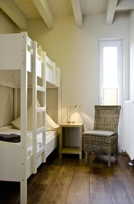 Ein Bett oder Betten in einem Zimmer der Unterkunft Ferienwohnungen Boddenfischer