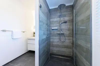 Ein Badezimmer in der Unterkunft Dünenquartier - 3 Obergeschoss mit Ostseeblick - 600m zum Strand