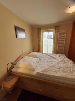Ein Bett oder Betten in einem Zimmer der Unterkunft Lindenstr 38 Wg 12 