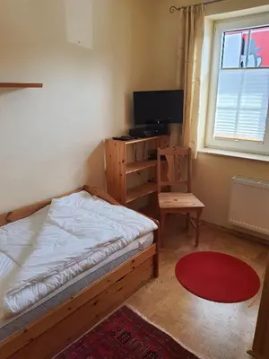 Ein Bett oder Betten in einem Zimmer der Unterkunft Lindenstr 38 Wg 12 
