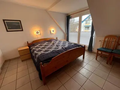 Ein Bett oder Betten in einem Zimmer der Unterkunft Zingst Wohnung 11 Darßer Weg 26A