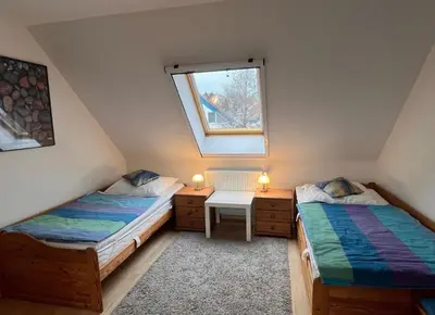 Ein Bett oder Betten in einem Zimmer der Unterkunft Zingst Wohnung 11 Darßer Weg 26A