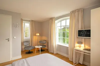 Ein Bett oder Betten in einem Zimmer der Unterkunft Der Charlottenhof